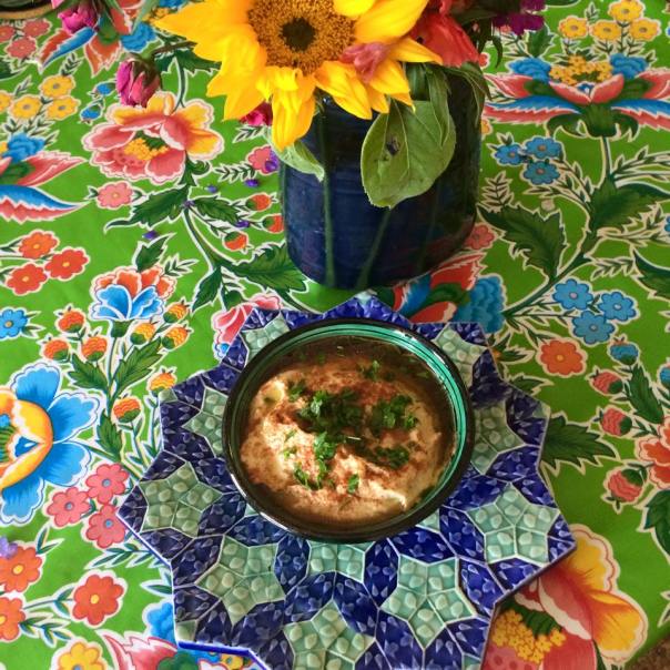 Hummus served right, in a beautiful Moroccan bowl, with Henry's Olive Oil, paprika and chopped parsley from my garden. The plate underneath the bowl was made by my brother Paul Barchilon