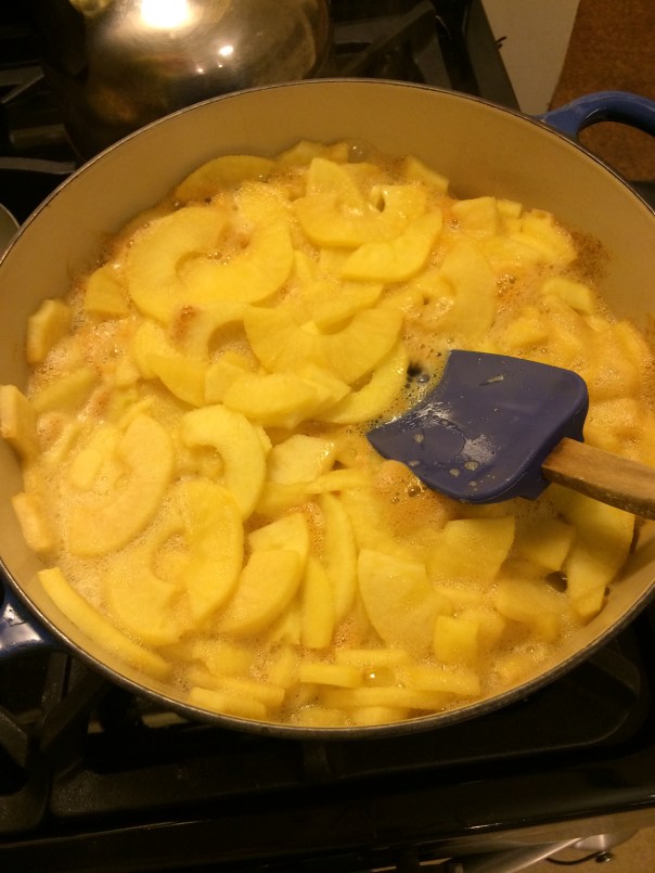 Peeled and Sliced apples cooking in applejuice.