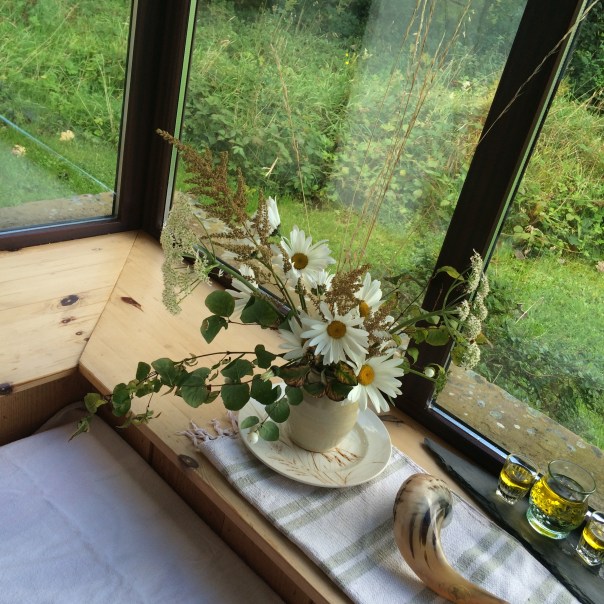 Erev Yom Kippur at my cabin in Ireland, getting ready for a day alone of fasting and prayers, by setting the space with beauty and white for purity of intention and space